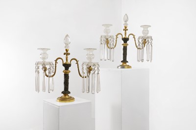 Lot 354 - A pair of George III-style patinated and gilt-bronze candelabra