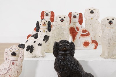 Lot 411 - A collection of large Staffordshire pottery dogs