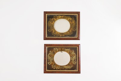 Lot 397 - A pair of verre églomisé mirrors