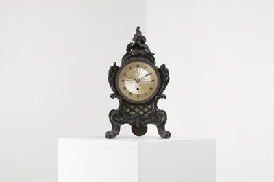 Lot 460 - A cast bronze rococo-style mantel clock