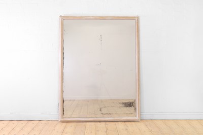 Lot 554 - A limewashed pine wall mirror
