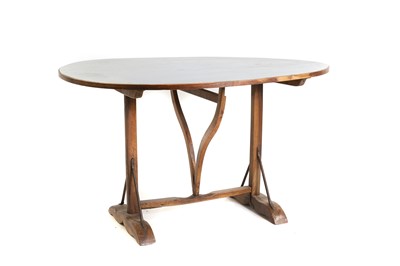 Lot 512 - A carved walnut folding wine table