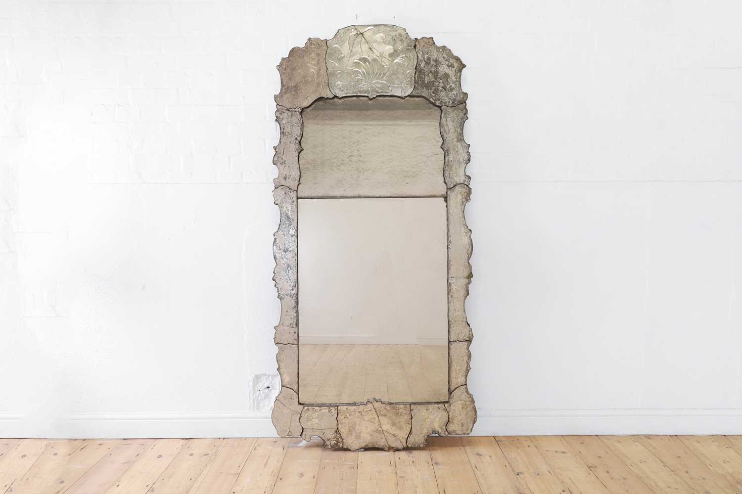 Lot 526 - An etched glass mirror