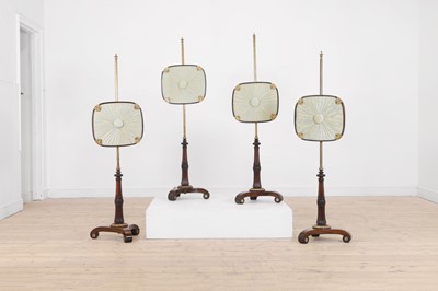 Lot 353 - A set of four Regency rosewood pole screens attributed to Banting, France & Co.