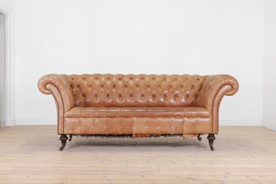 Lot 540 - A tan leather chesterfield sofa