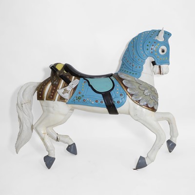 Lot 687 - A carved and painted hardwood fairground horse in the manner of Charles Loof