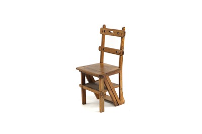 Lot 557 - A Victorian oak metamorphic library chair