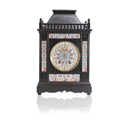 Lot 66 - An ebonised mantel clock