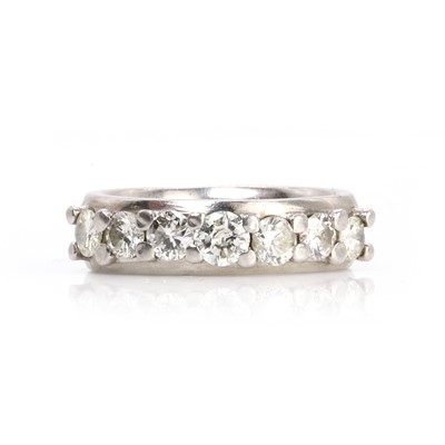 Lot 145 - A platinum and diamond half eternity ring
