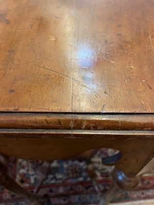 Lot 17 - A walnut centre table