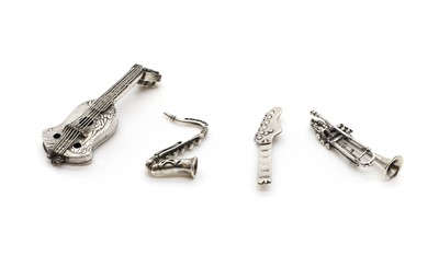 Lot 67 - A group of four silver novelty musical instruments