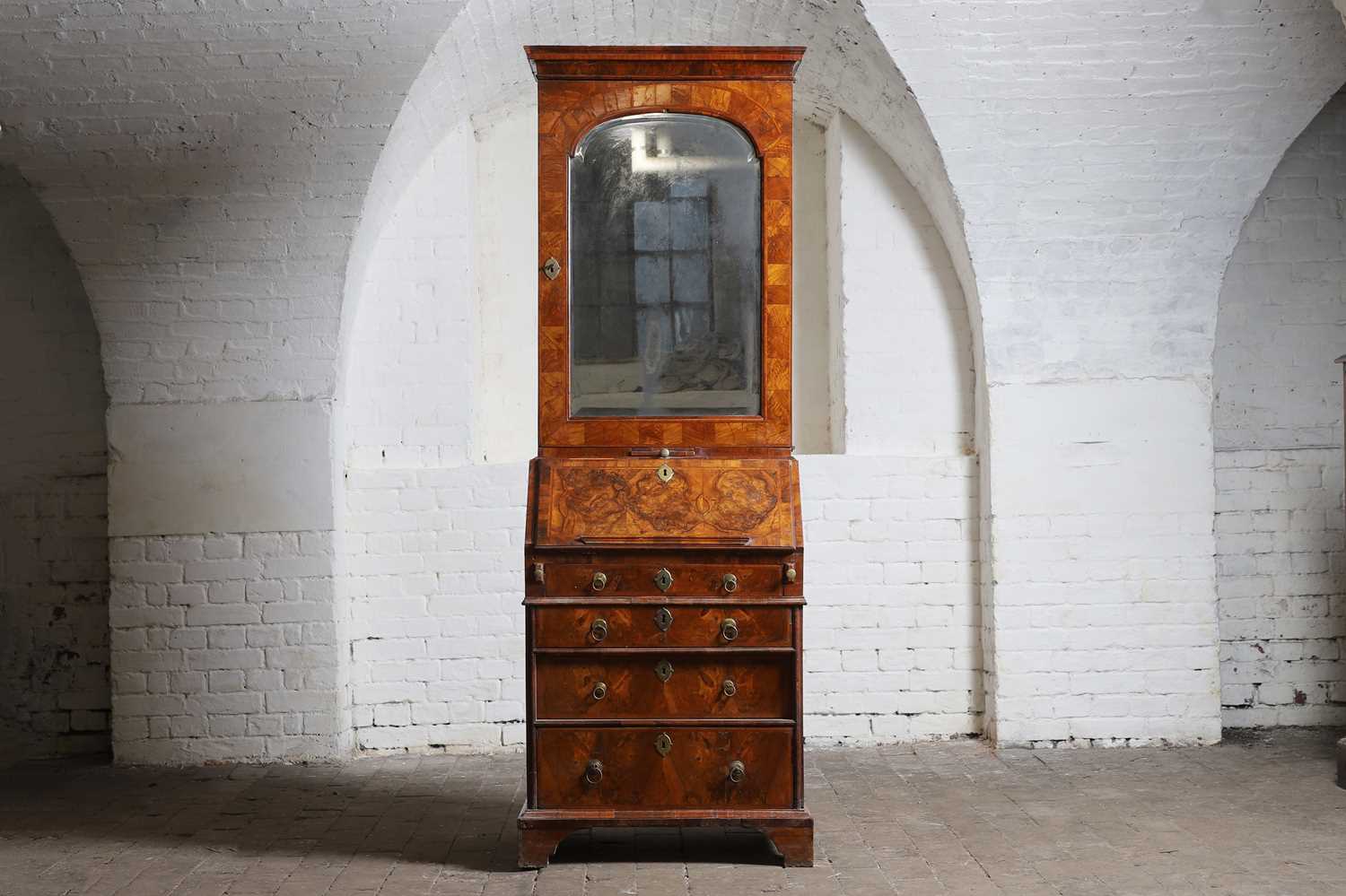 Lot 177 - A narrow walnut bureau bookcase