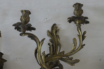 Lot 183 - A set of four twin-branch neoclassical wall lights