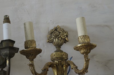 Lot 183 - A set of four twin-branch neoclassical wall lights