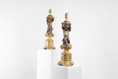 Lot 182 - A pair of ormolu lamps