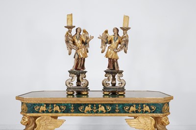 Lot 152 - A pair of carved, painted, silvered and giltwood torchères