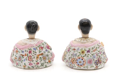 Lot 138 - A pair of porcelain nodding pagoda figures