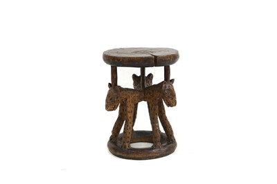 Lot 483 - An African carved stool