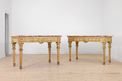 Lot 474 - A matched pair of Louis XVI giltwood console tables
