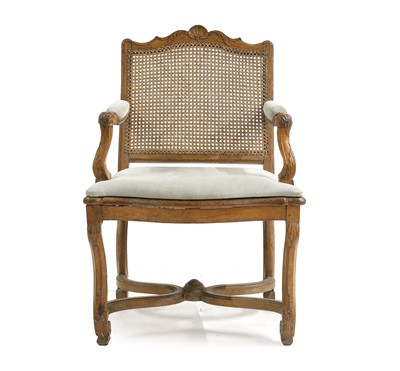 Lot 765 - A Louis XV provincial beechwood caned fauteuil