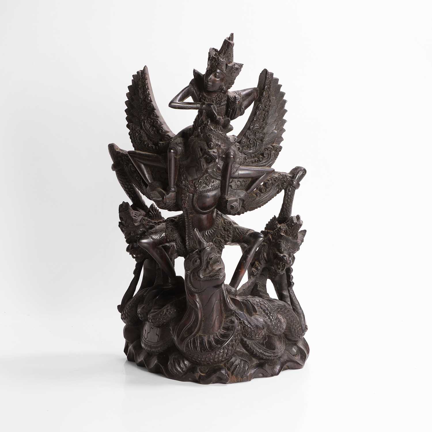 Lot 22 - A carved blackwood figural group
