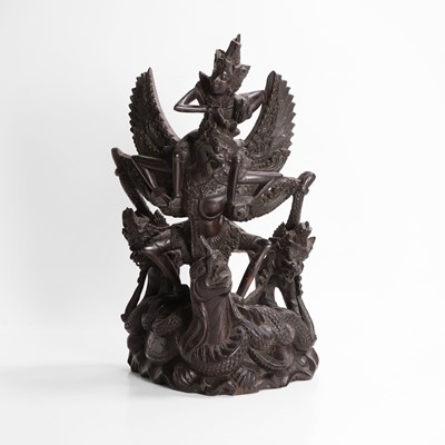 Lot 22 - A carved blackwood figural group