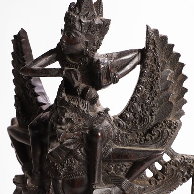 Lot 22 - A carved blackwood figural group