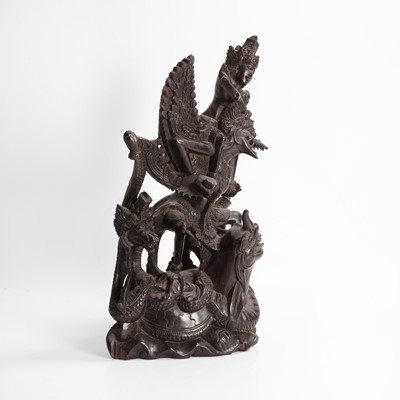 Lot 22 - A carved blackwood figural group
