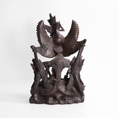Lot 22 - A carved blackwood figural group