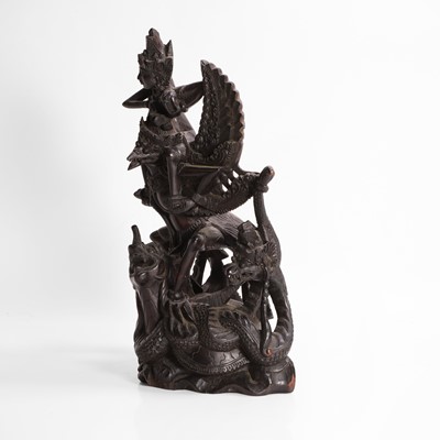 Lot 22 - A carved blackwood figural group
