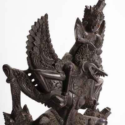 Lot 22 - A carved blackwood figural group