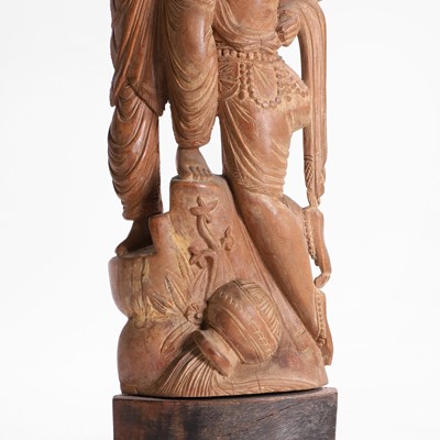 Lot 23 - A carved teak figural group