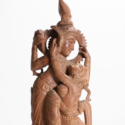 Lot 23 - A carved teak figural group