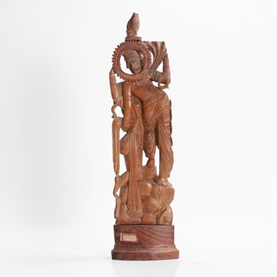 Lot 23 - A carved teak figural group