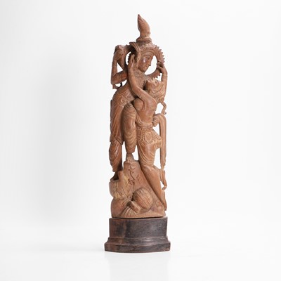 Lot 23 - A carved teak figural group