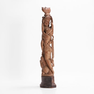 Lot 23 - A carved teak figural group