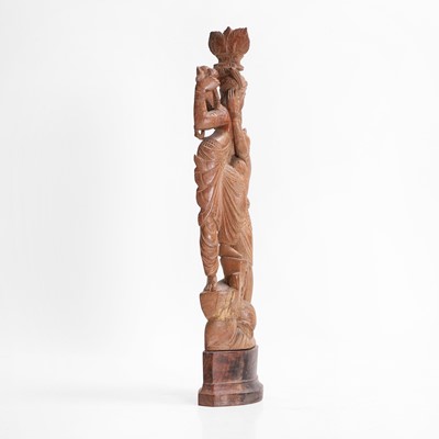 Lot 23 - A carved teak figural group
