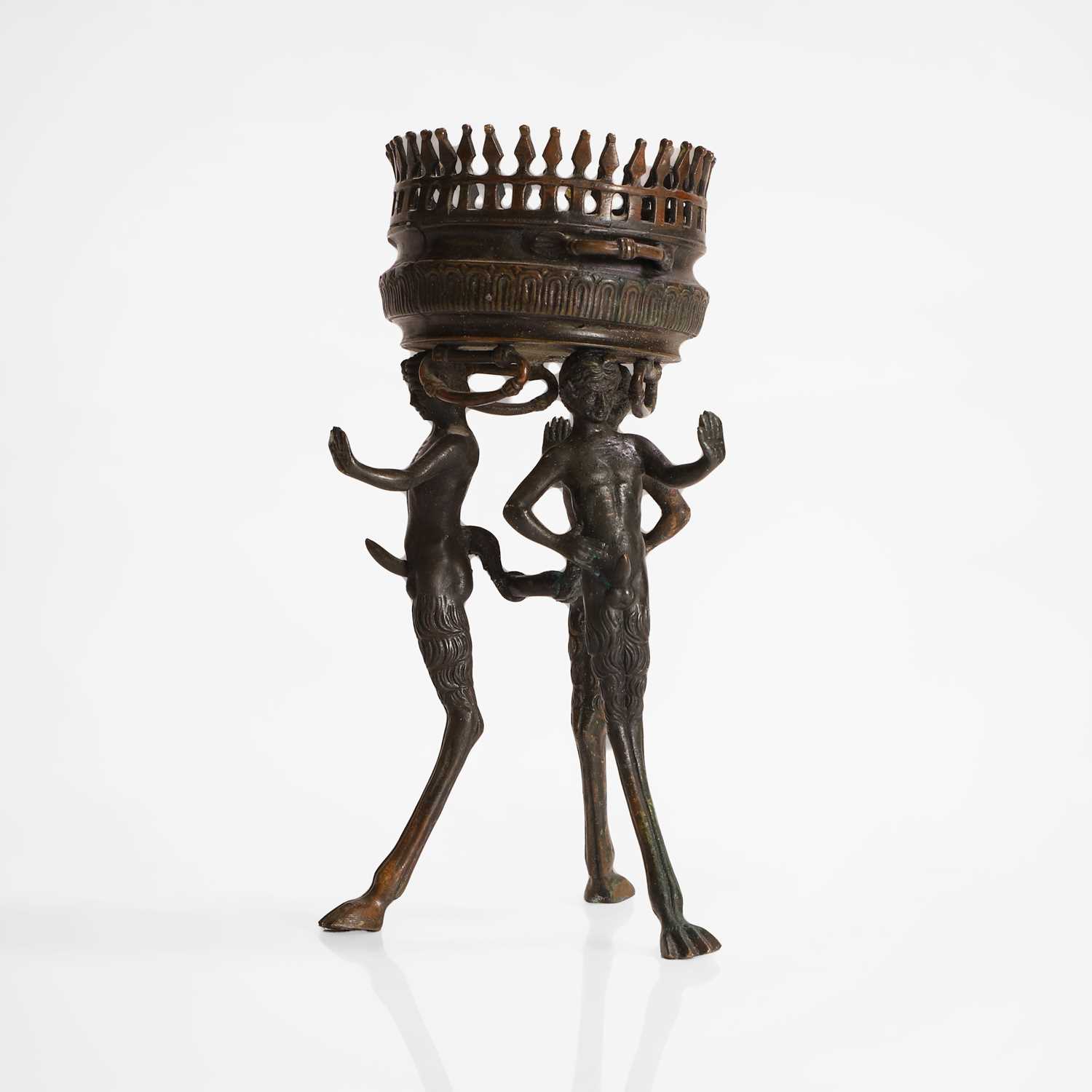 Lot 103 - A bronze tripod jardinière