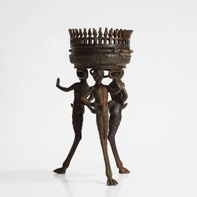 Lot 103 - A bronze tripod jardinière