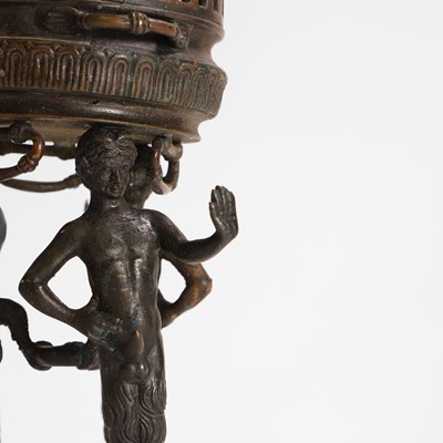 Lot 103 - A bronze tripod jardinière