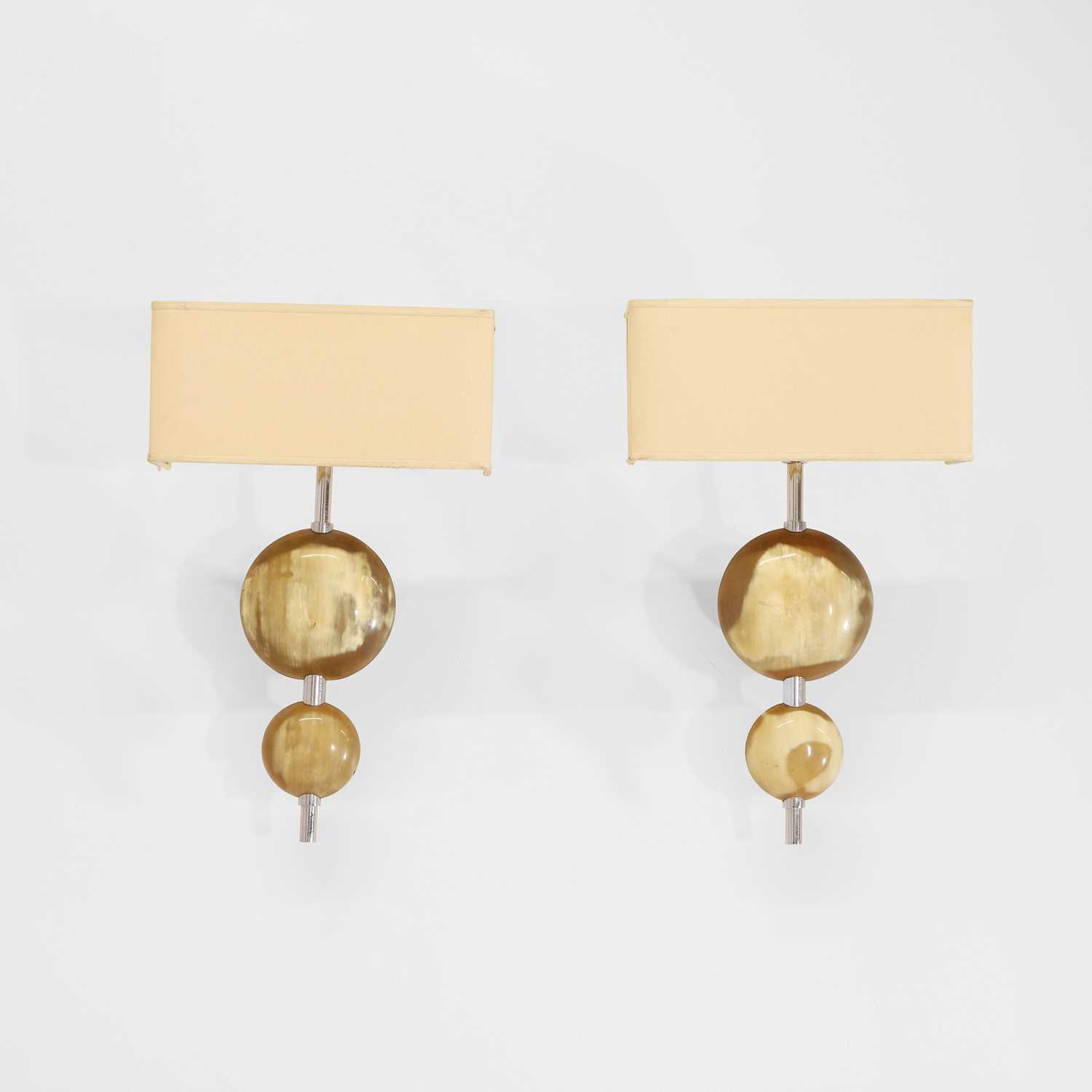 Lot 62 - A pair of horn and chrome wall lights