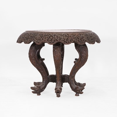 Lot 415 - A carved rosewood occasional table