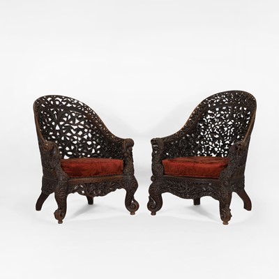 Lot 412 - A pair of Anglo-Indian hardwood armchairs
