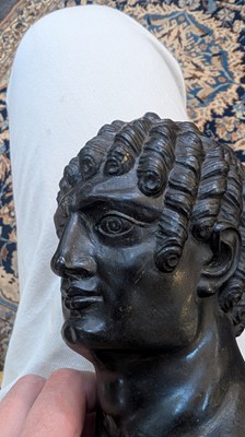 Lot 49 - A grand tour black marble bust of a man