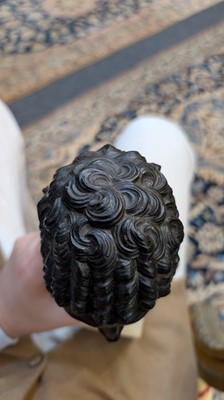 Lot 49 - A grand tour black marble bust of a man
