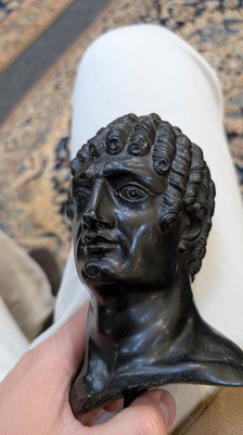 Lot 49 - A grand tour black marble bust of a man