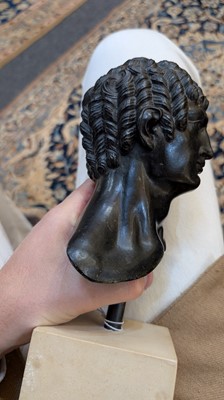 Lot 49 - A grand tour black marble bust of a man