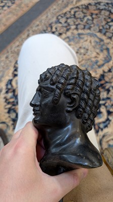 Lot 49 - A grand tour black marble bust of a man