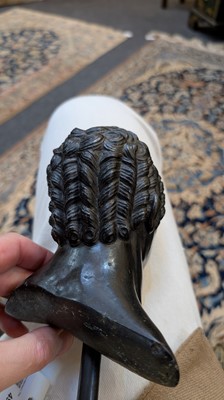 Lot 49 - A grand tour black marble bust of a man