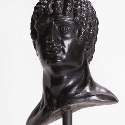 Lot 49 - A grand tour black marble bust of a man